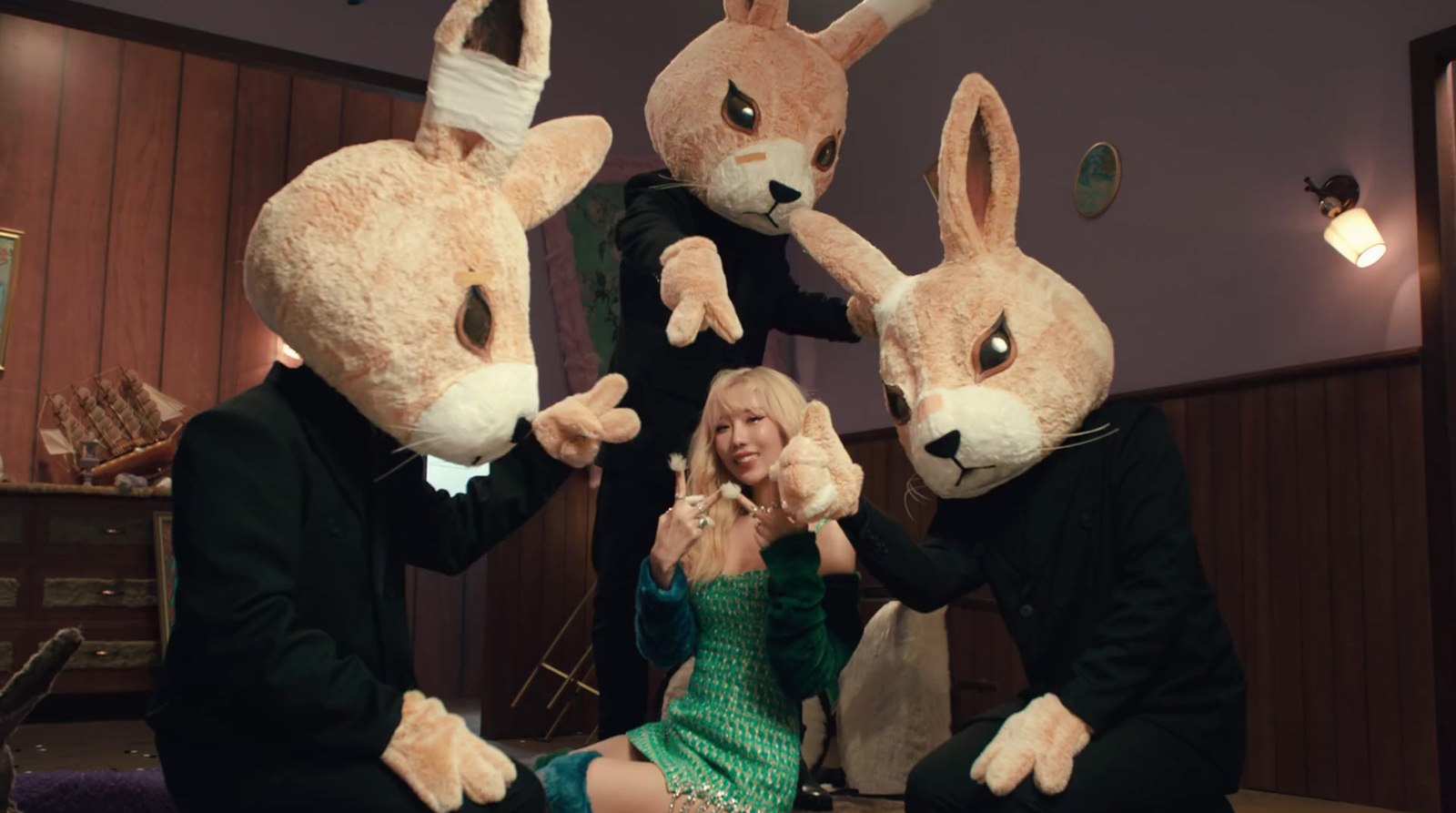 a group of people in bunny costumes sitting on a couch