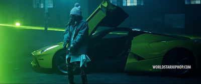 a man standing next to a yellow sports car