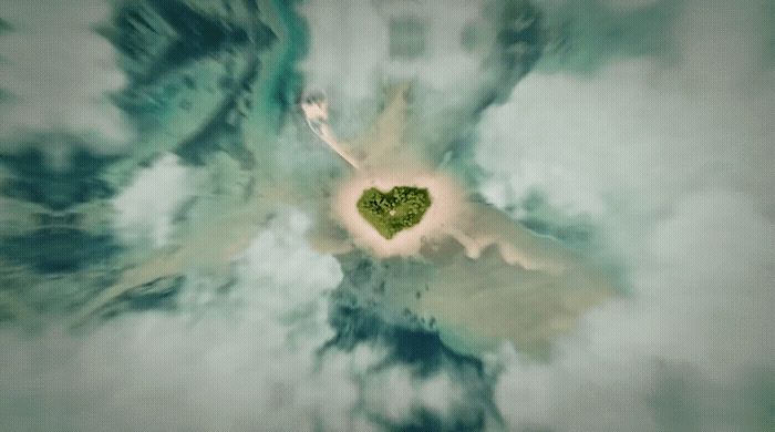 a heart shaped object floating in the air