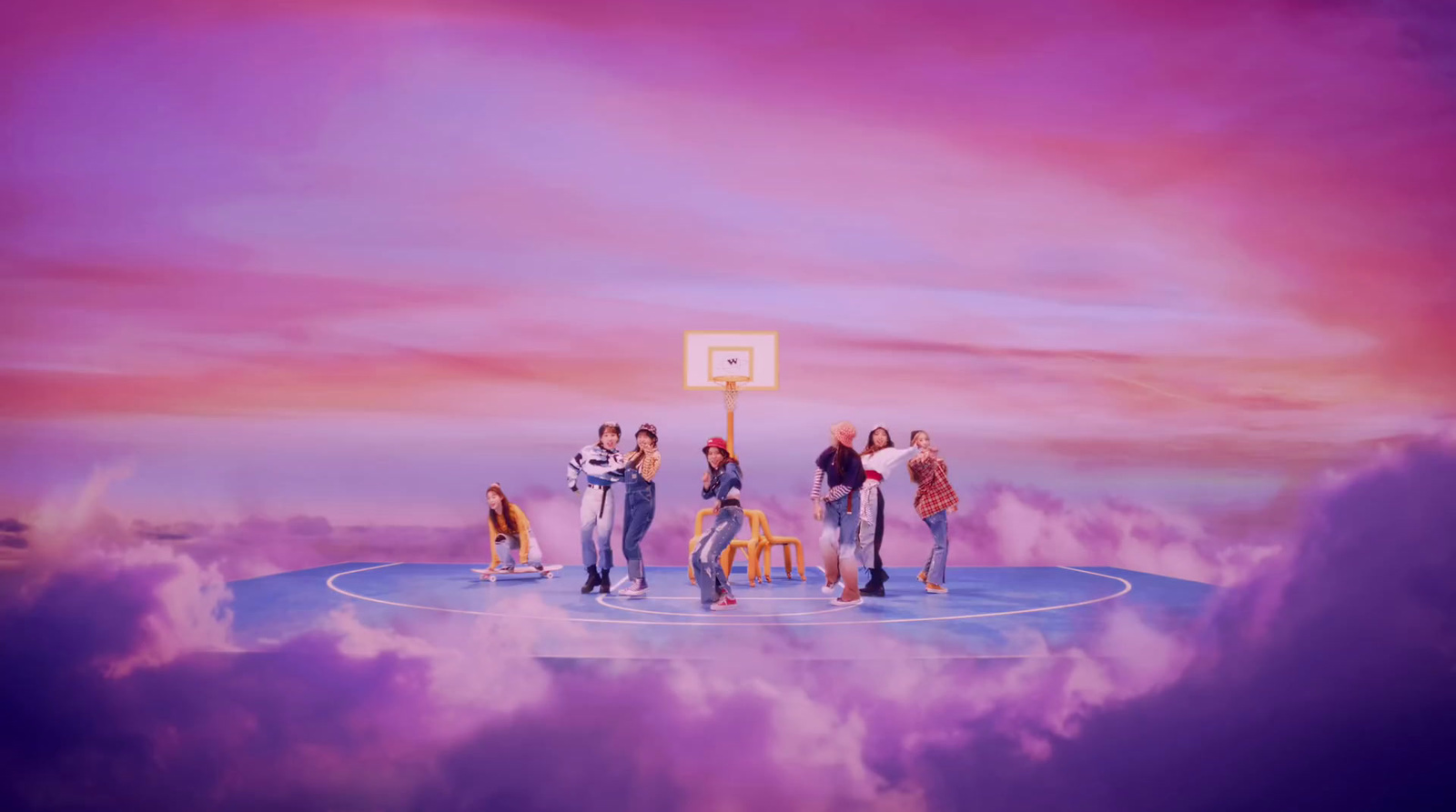 a group of people standing on top of a basketball court