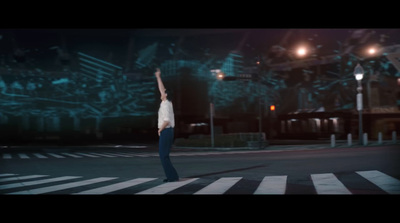 a person standing in the middle of a street at night