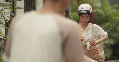 a woman wearing a helmet and carrying a basket