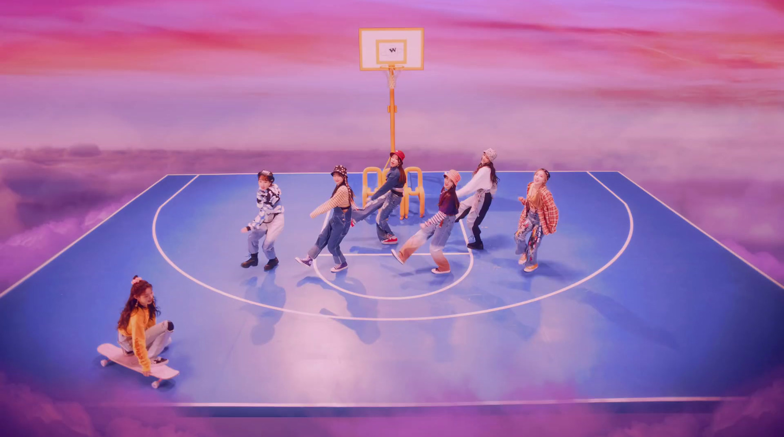 a group of people standing on top of a basketball court