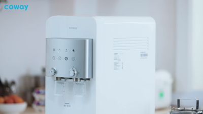 a water dispenser sitting on top of a counter