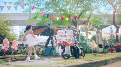 a woman in a white dress standing next to a motorcycle