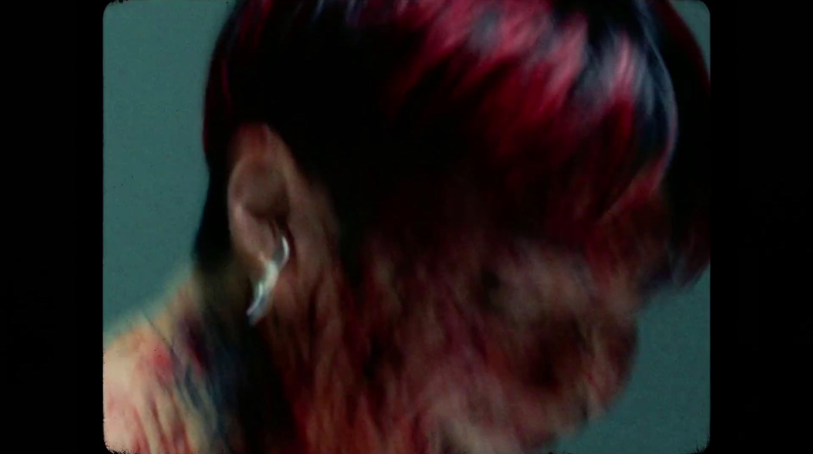 a close up of a person with red hair