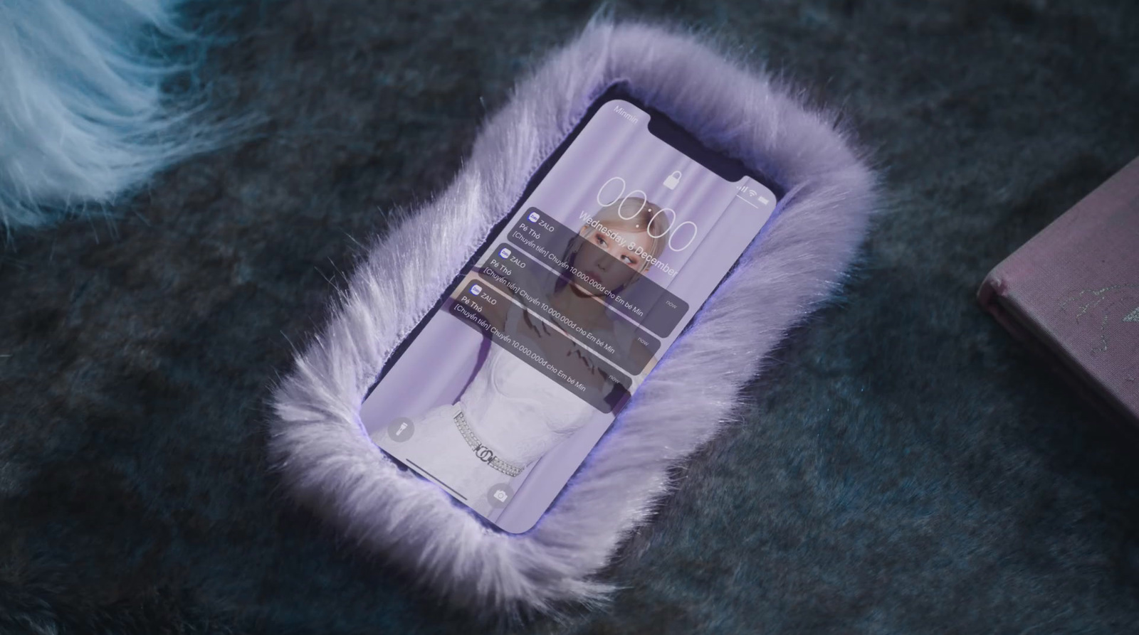 a cell phone laying on top of a furry case