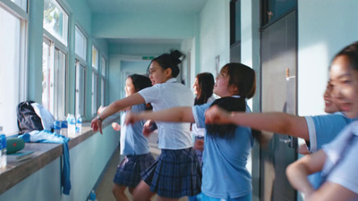 a group of people standing in a hallway