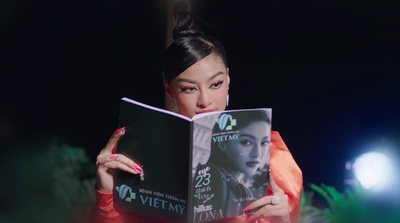 a woman reading a book in the dark