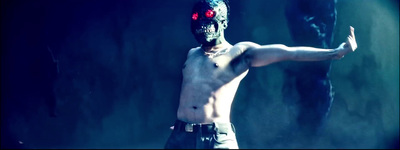 a shirtless man with red eyes holding a knife