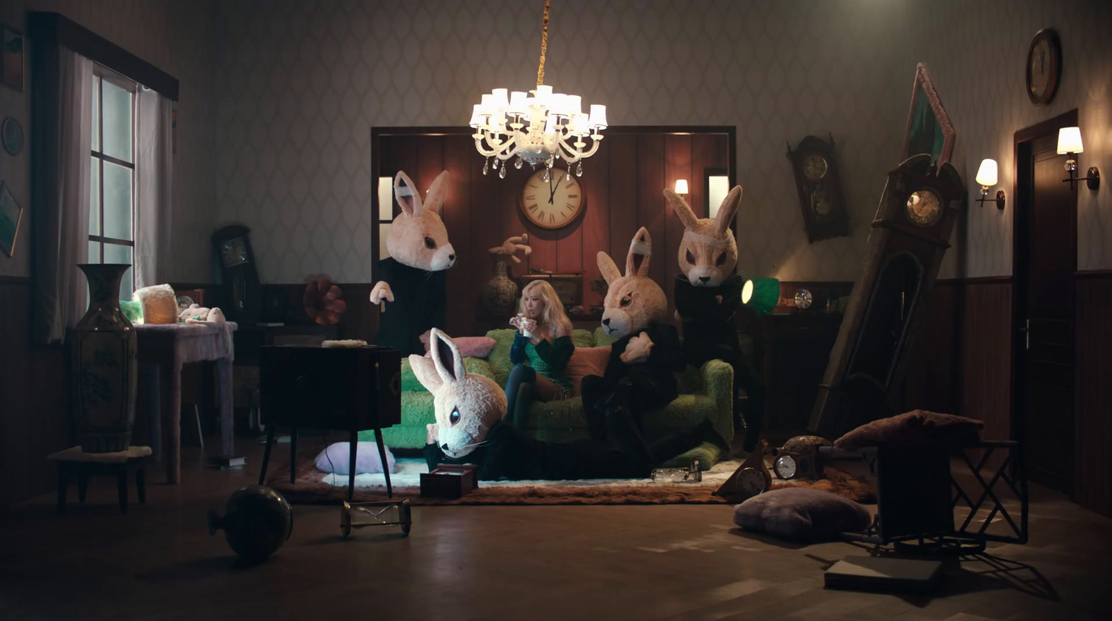 a group of rabbits sitting on a couch in a living room