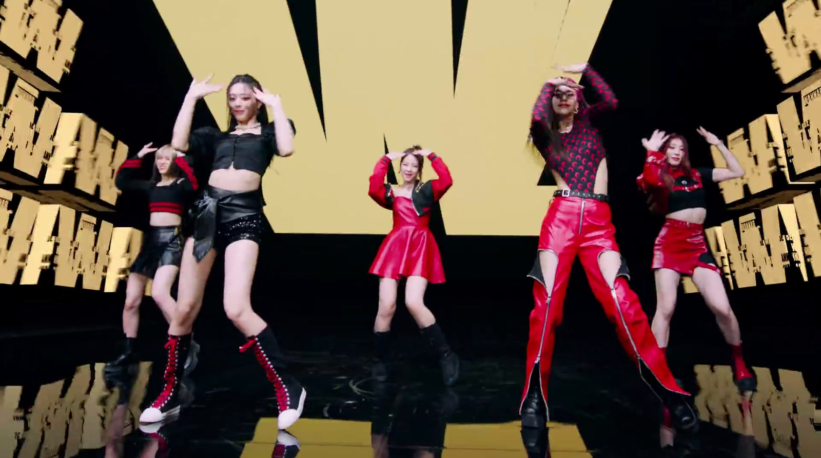 a group of women standing on top of a stage