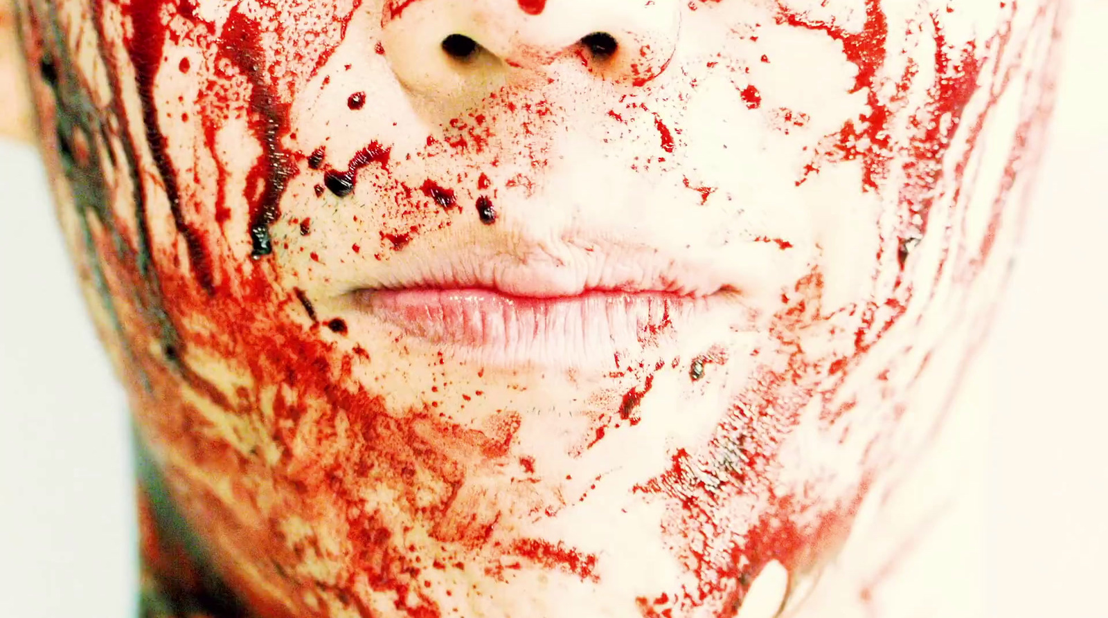 a woman with blood all over her face