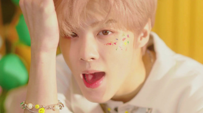 a young man with sprinkles on his face