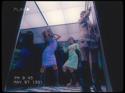 a group of young women standing next to each other