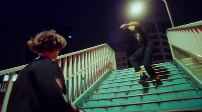 a man riding a skateboard down a set of stairs