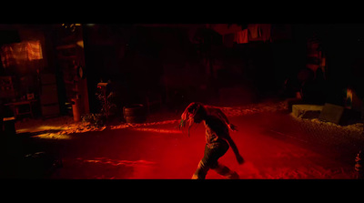 a person running through a dark street at night