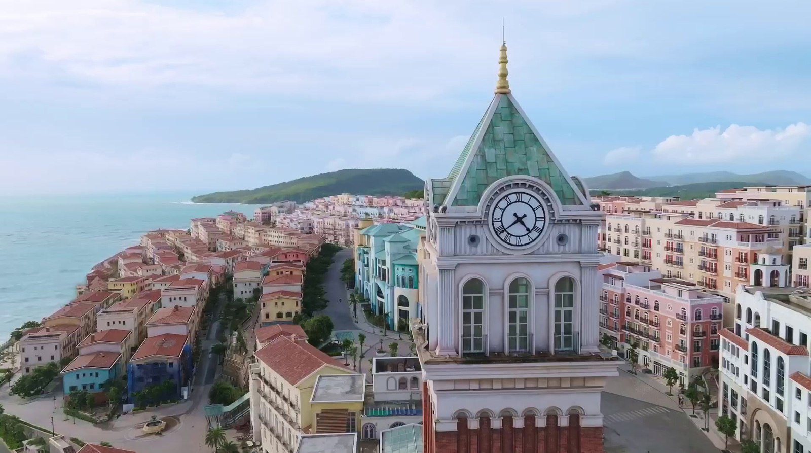 an aerial view of a city with a clock tower