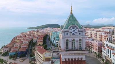 an aerial view of a city with a clock tower