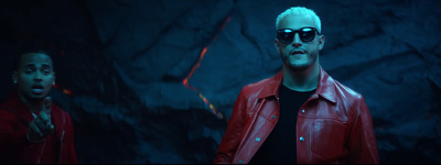 a man in a red leather jacket and sunglasses