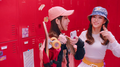 two young women standing in front of lockers