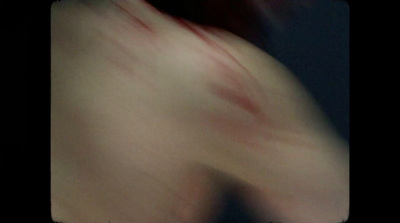 a blurry image of a person's torso