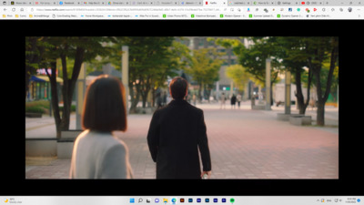 a man and a woman walking down a street