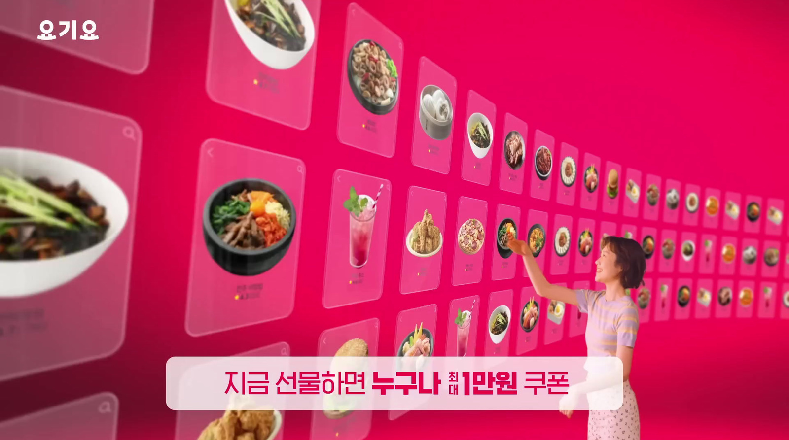 a woman standing in front of a wall with pictures of food on it