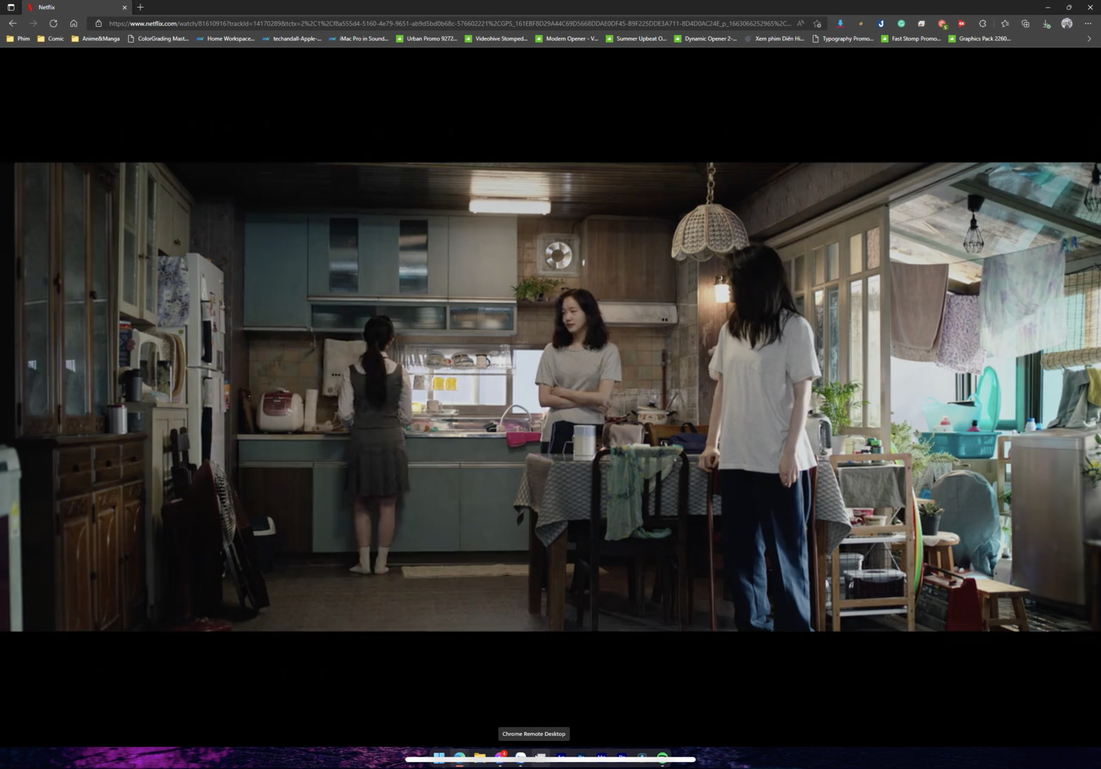 a couple of women standing in a kitchen next to each other