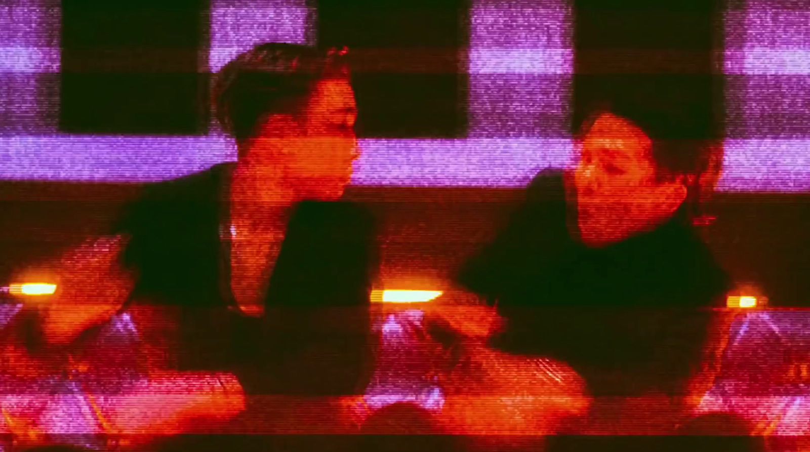 a couple of women sitting next to each other
