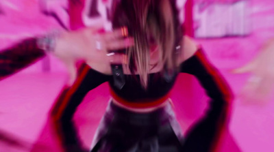 a blurry photo of a woman in a black and red outfit