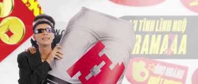 a woman holding up a giant red and white object