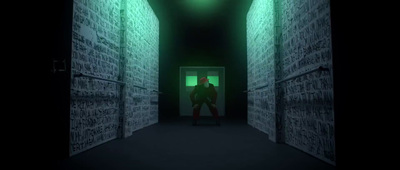 a man is standing in a dark hallway