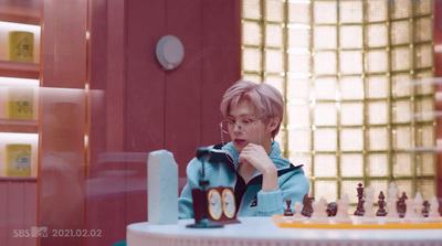 a young boy playing a game of chess