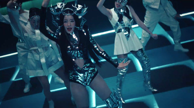 a group of women dressed in shiny outfits