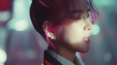 a close up of a person with pink hair