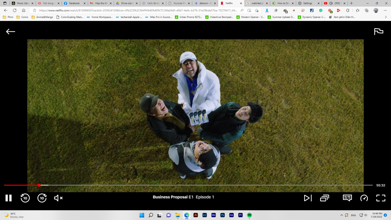 a group of people standing on top of a lush green field