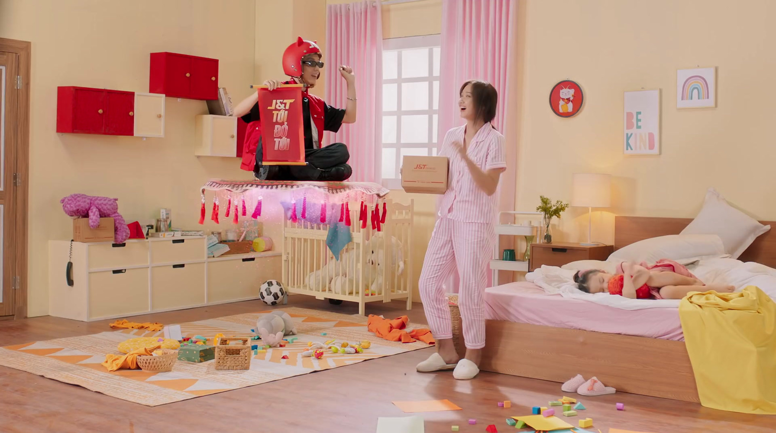 a man and a woman standing in a bedroom