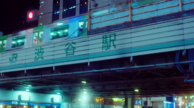 a train traveling over a bridge at night