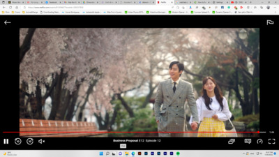 a man and a woman walking down a street