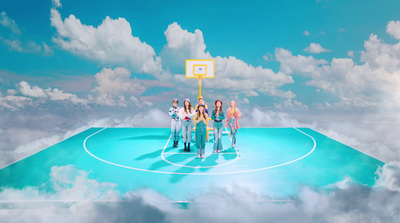 a group of people standing on top of a basketball court