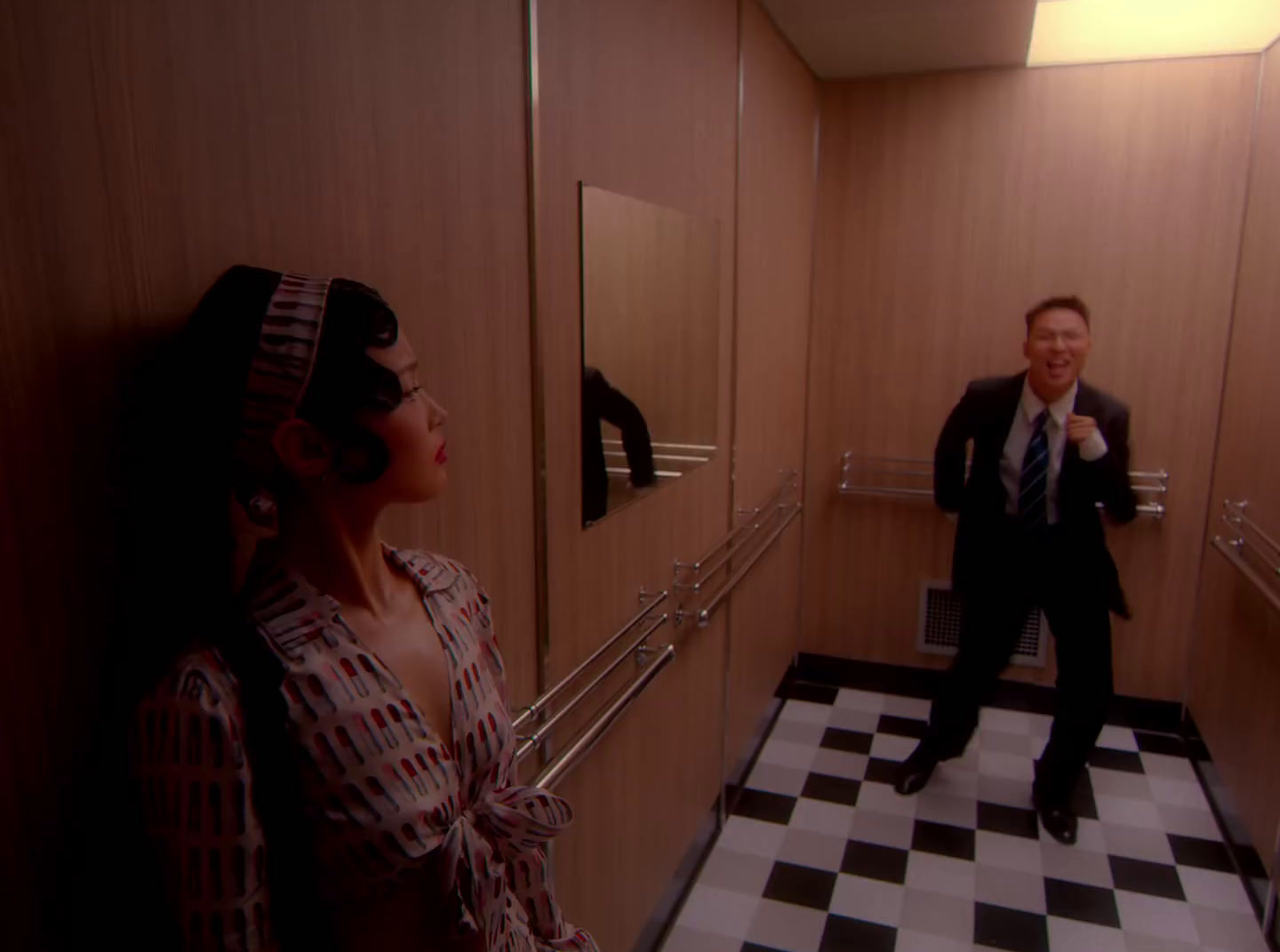 a man and a woman standing in a hallway