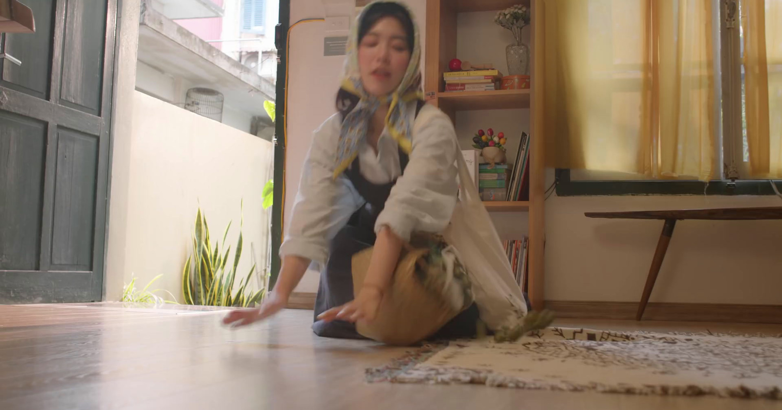 a woman sitting on the floor in a room