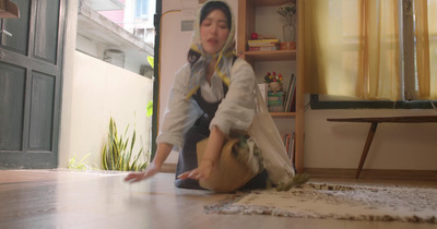 a woman sitting on the floor in a room