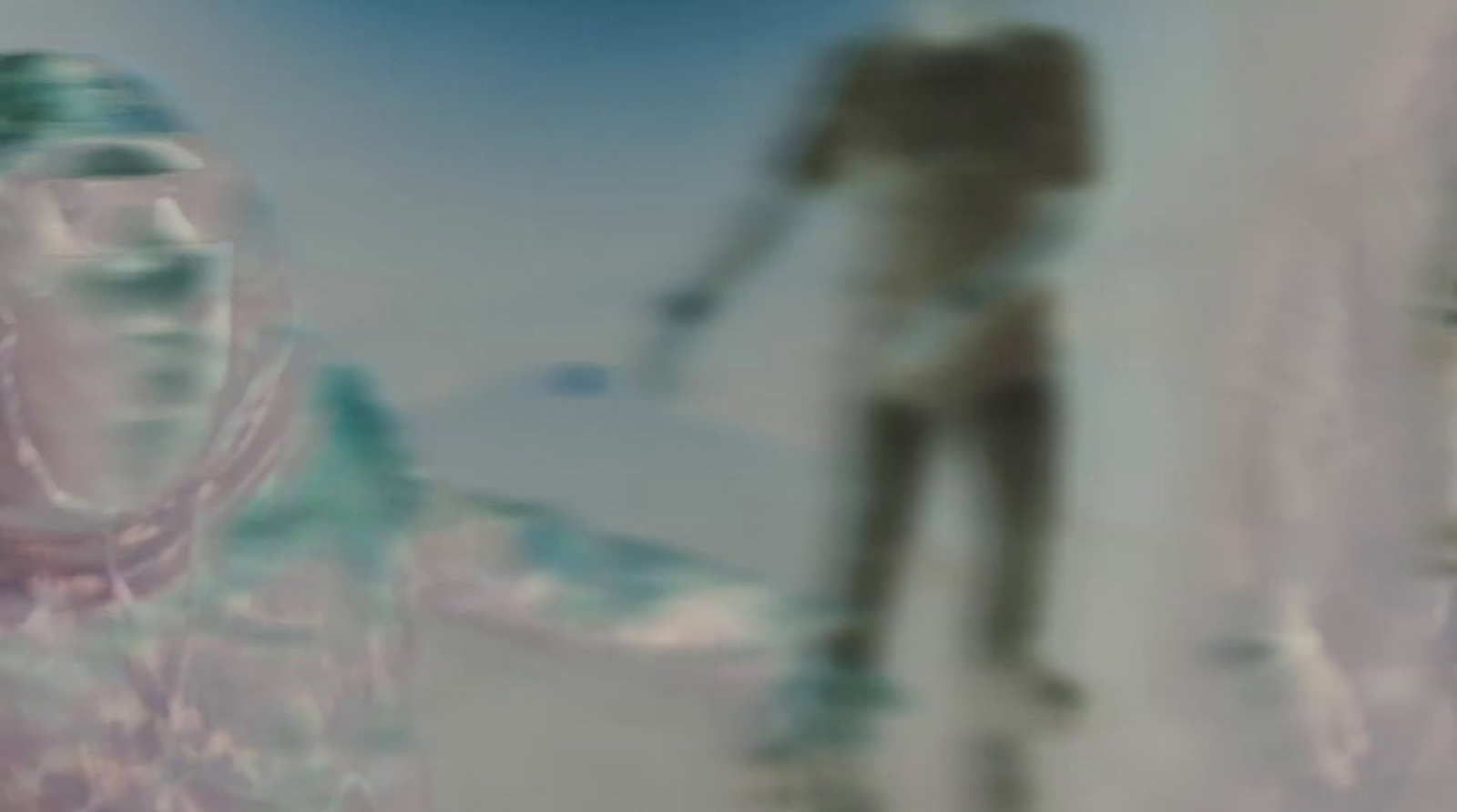 a blurry image of a man riding a skateboard