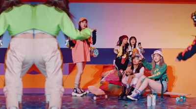 a group of young women sitting on top of a stage