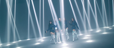 a group of women standing on top of a stage