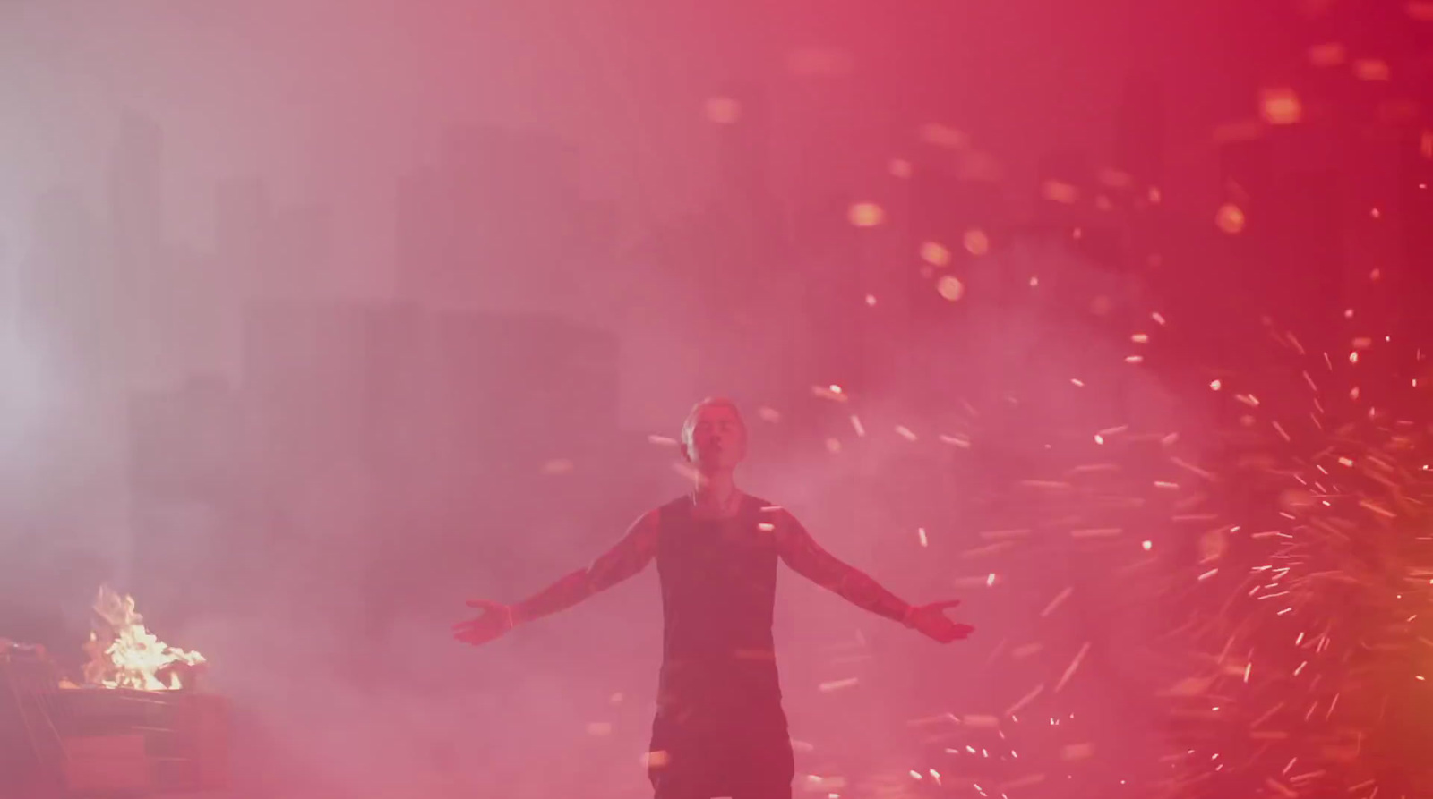 a man standing in front of a firework display