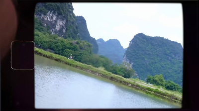 a view of a river with mountains in the background