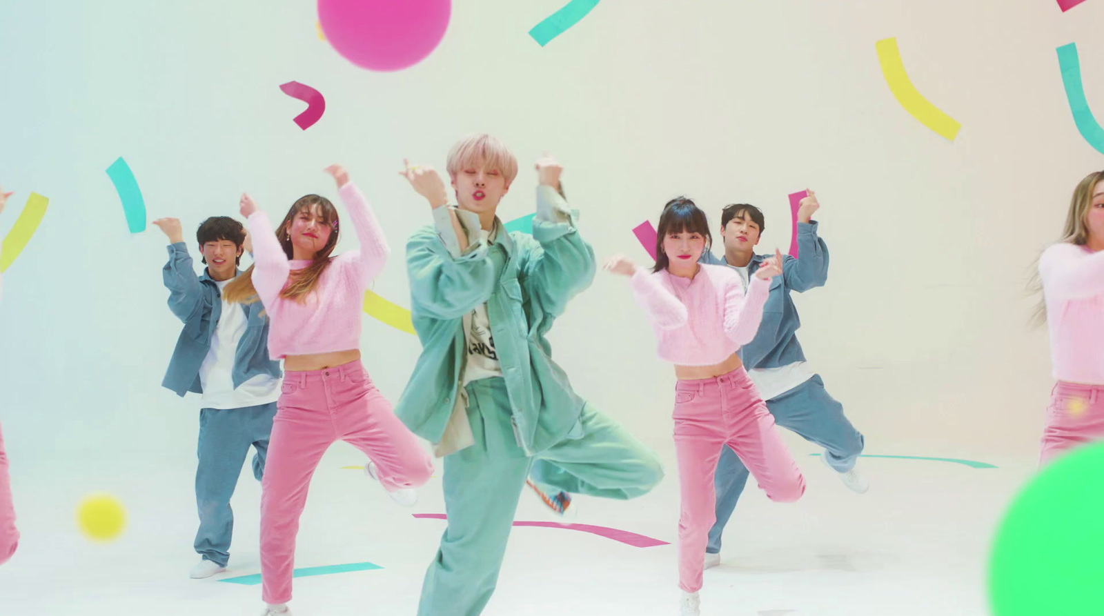 a group of young people dancing in front of a white background